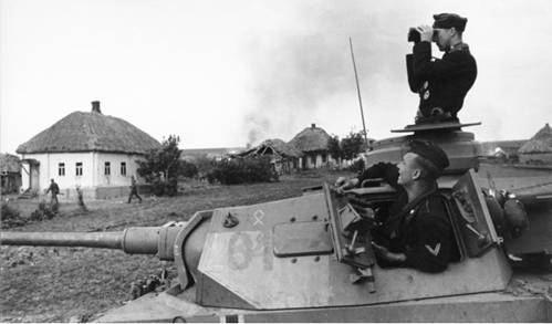 Němečtí tankisté v tanku PzKpfw III.jpg